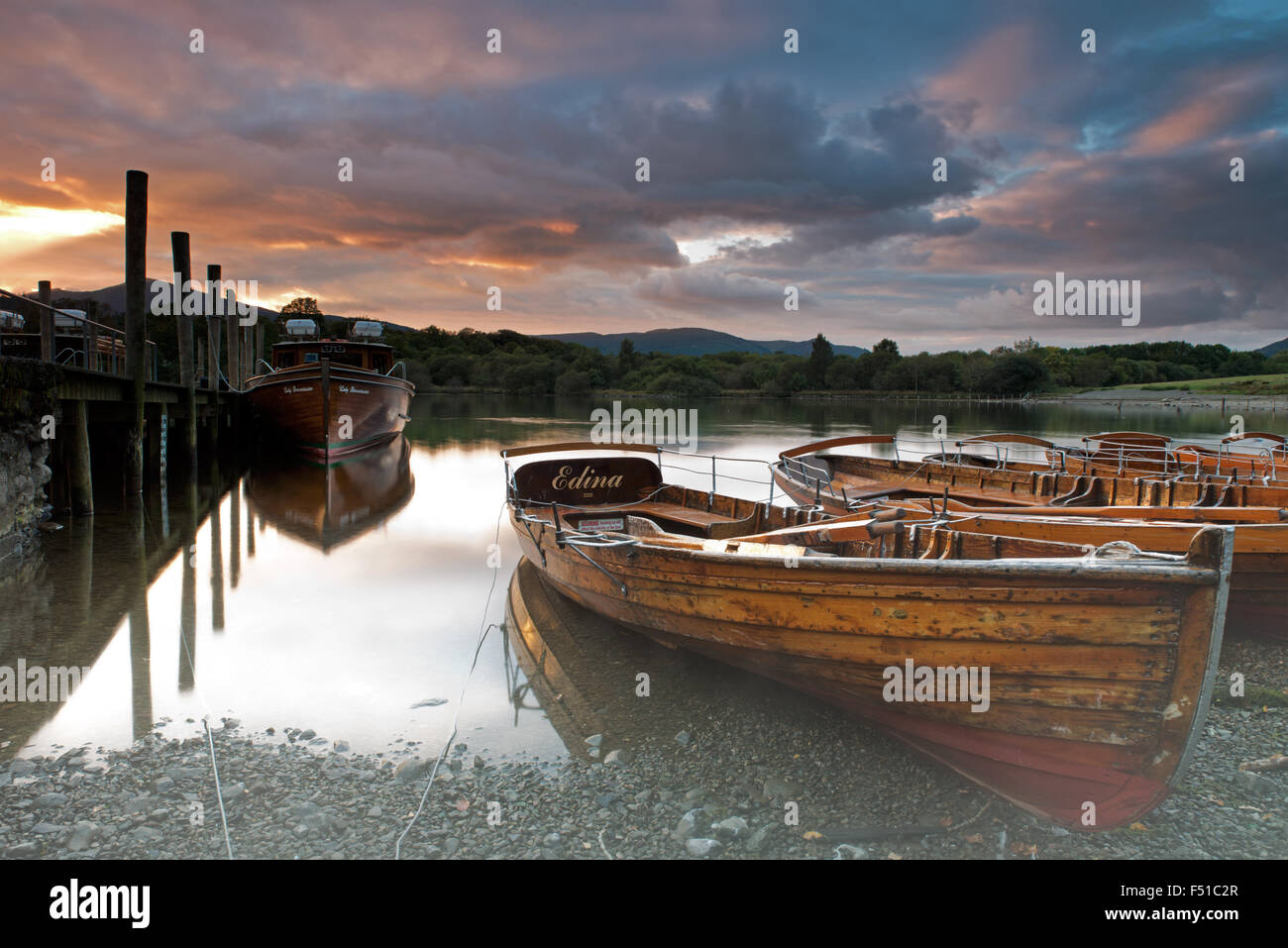 Rowing boats on the shore of Derwent Water near Keswick at sunset, Lake District, Cumbria, England, Uk, Gb Stock Photo