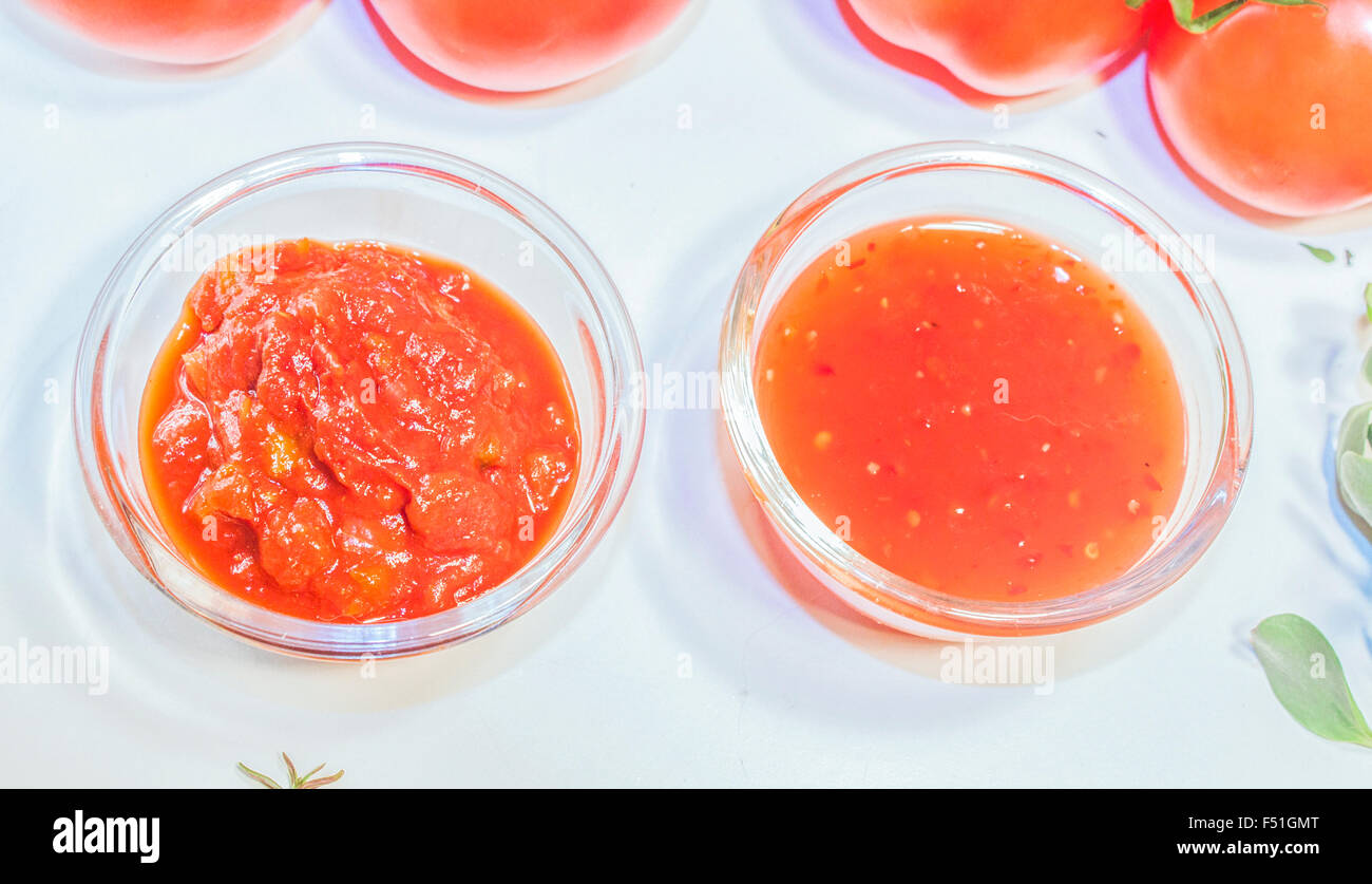 Salsa and chili sauce, on a white table Stock Photo