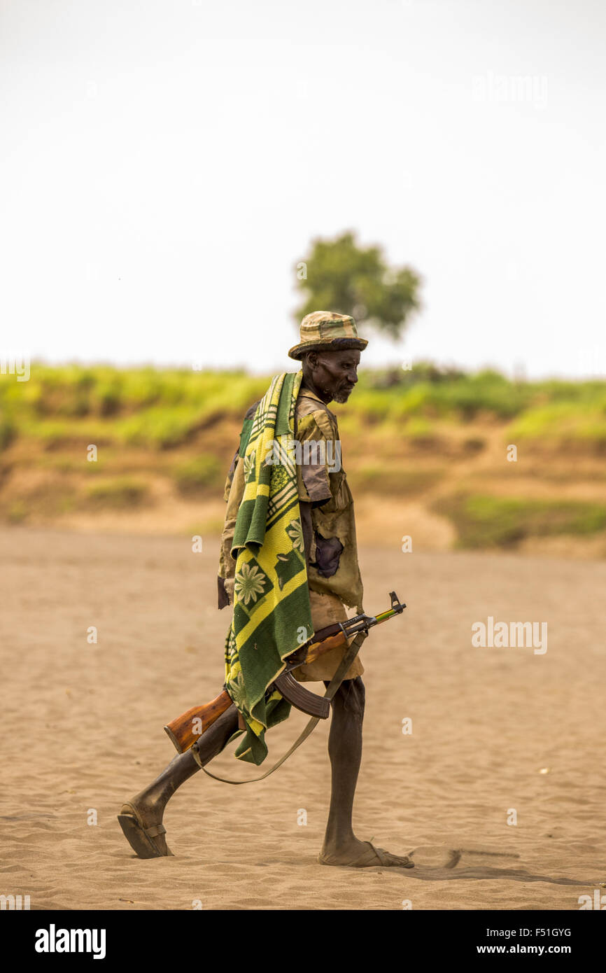 Nyangatom tribesman. Most adult males carry rifles. Omo Valley, Ethiopia Stock Photo