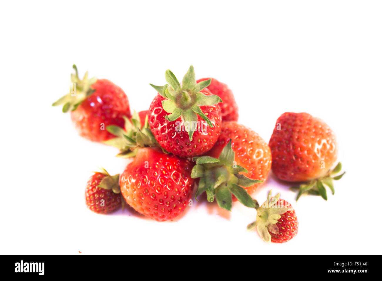 A pile of red strawberries, isolated on white background Stock Photo ...