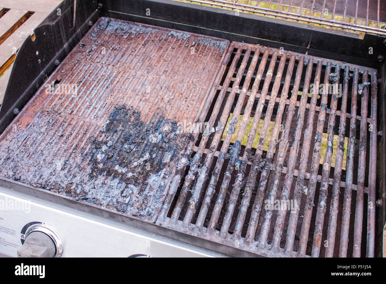 A dirty grill, full of old food and rust Stock Photo Alamy