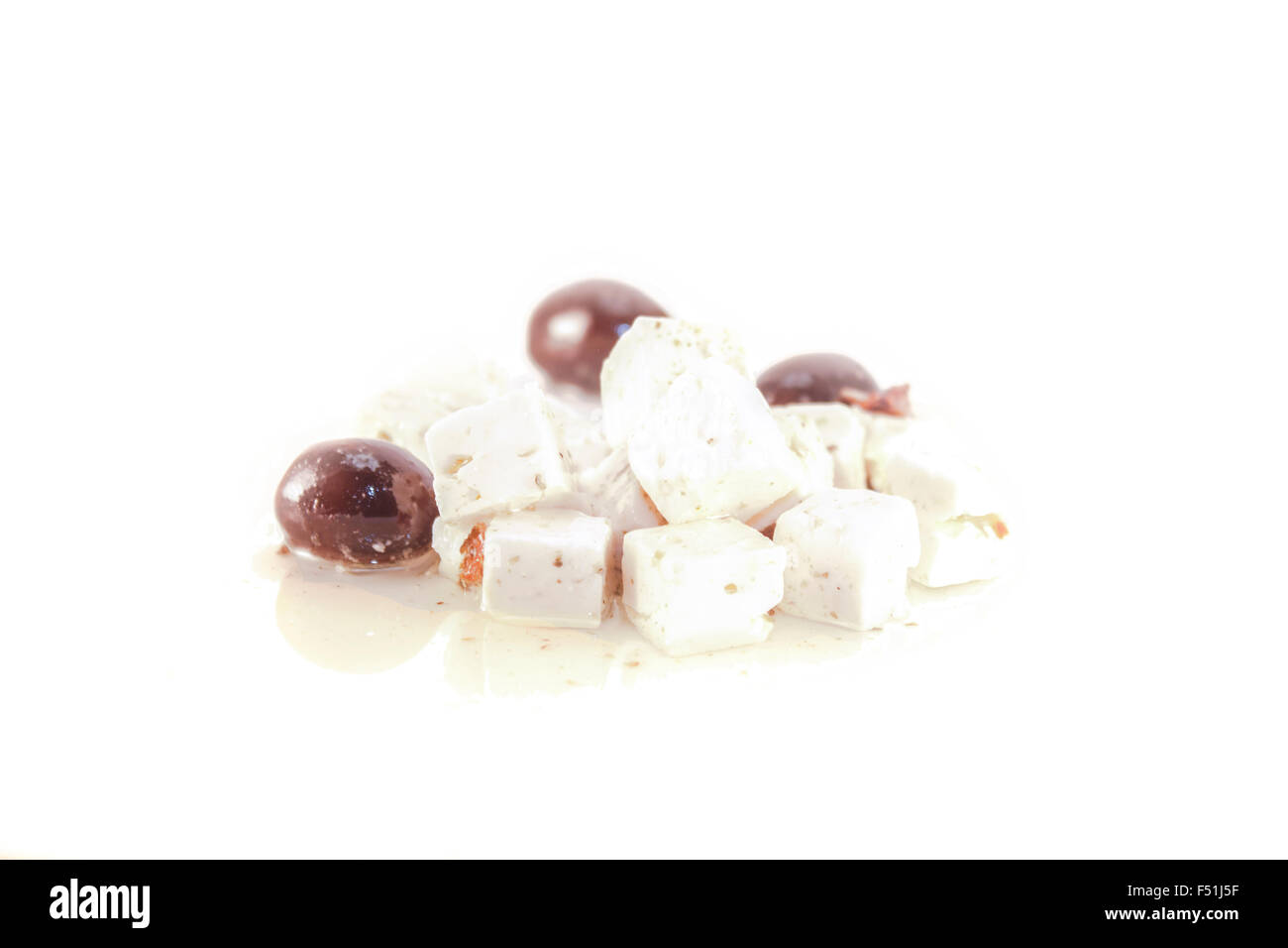 White feta and black olives, isolated on white background Stock Photo
