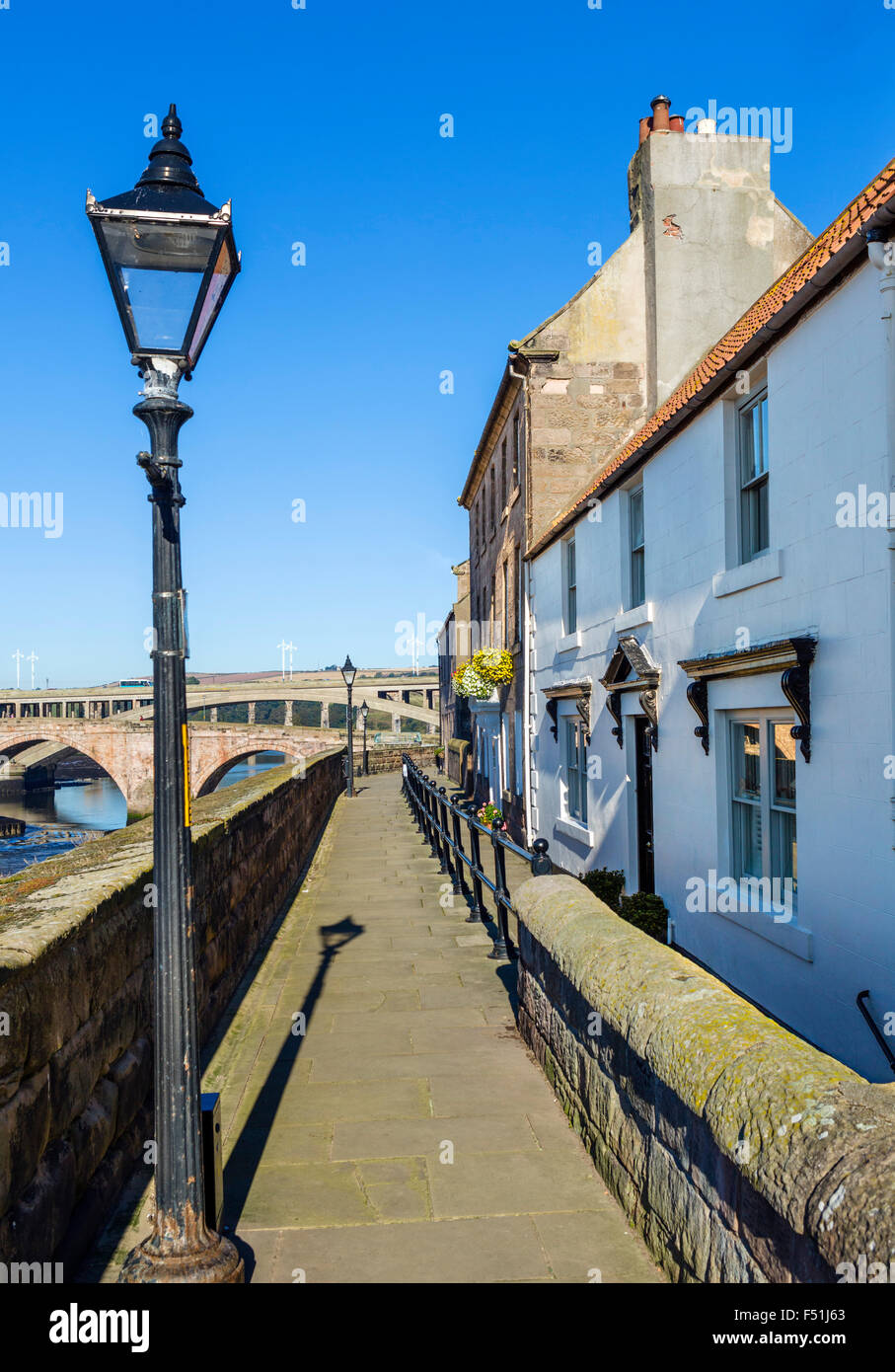 Path along the Quay Walls looking towards bridges over the River Tweed, Berwick-upon-Tweed, Northumberland, England, UK Stock Photo