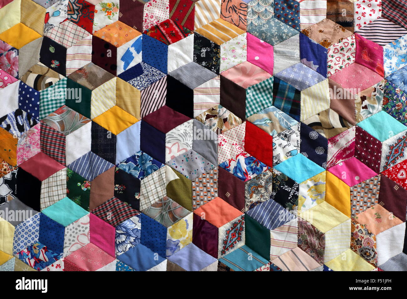 Patchwork quilt, tumbling blocks design Stock Photo