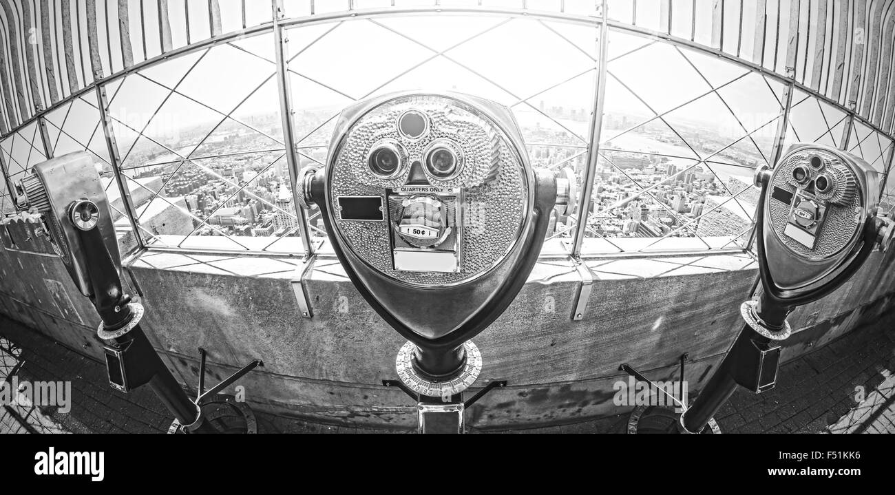 Black and white fisheye lens toned photo of tourist binoculars over Manhattan, New York City, USA. Stock Photo