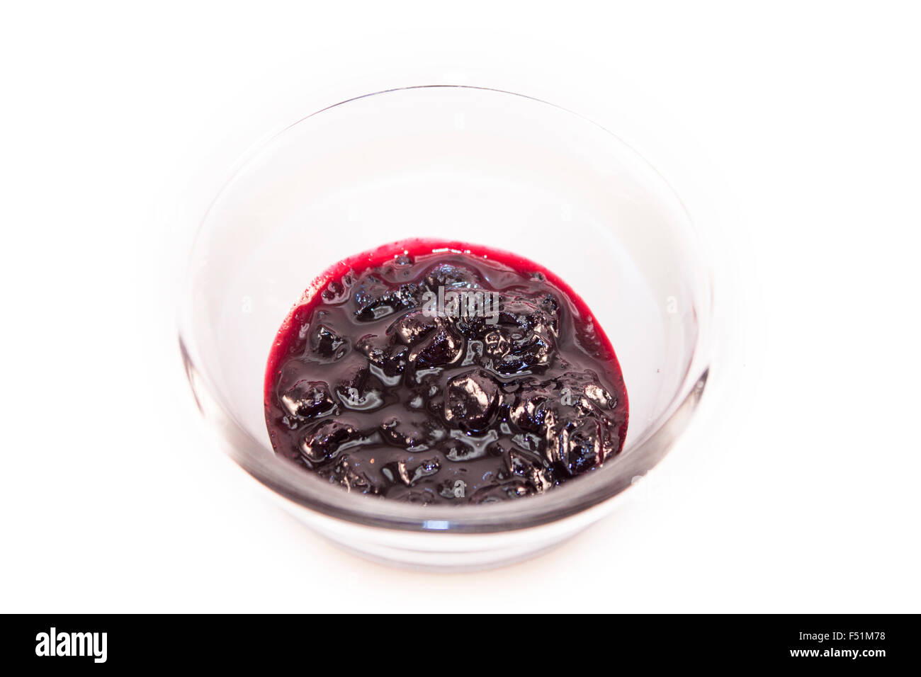 Black currant, ribes nigrum jam, in a glass bowl, isolated on white background Stock Photo
