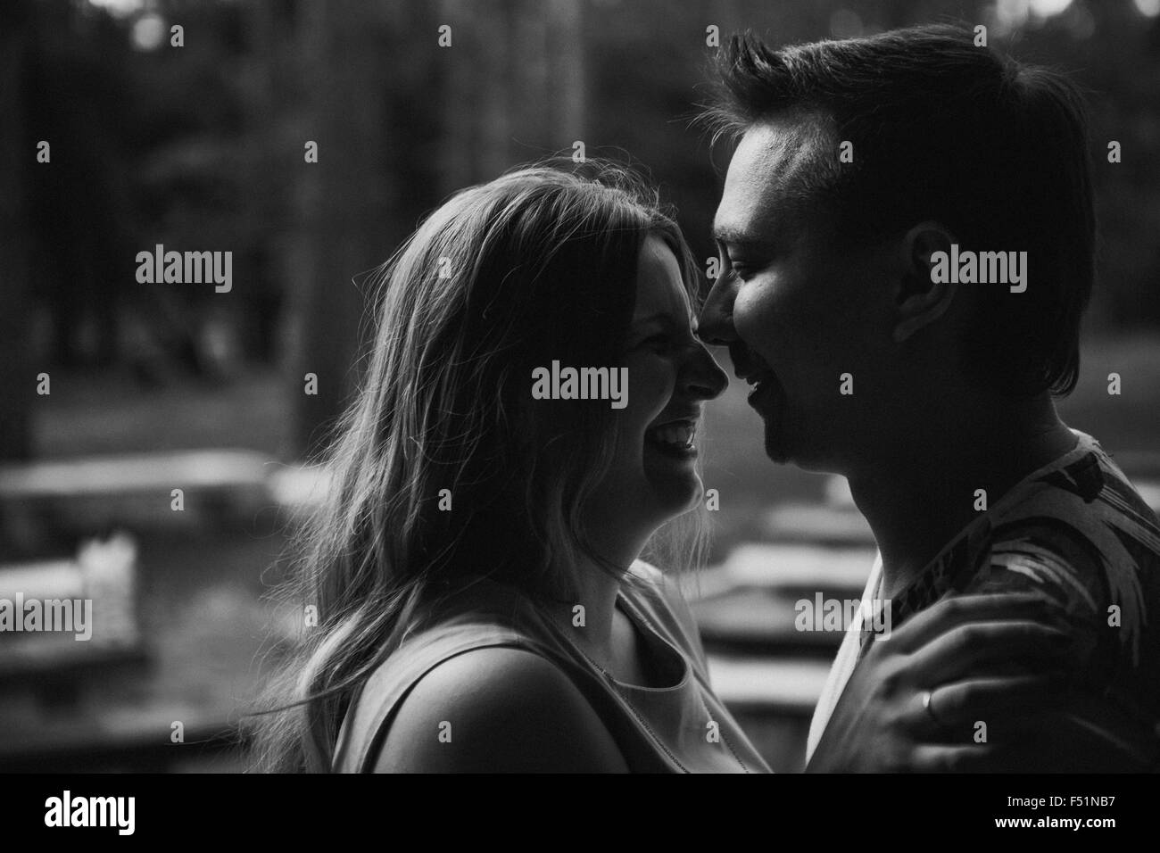 Romantic black and white photo young couple kissing on background ...