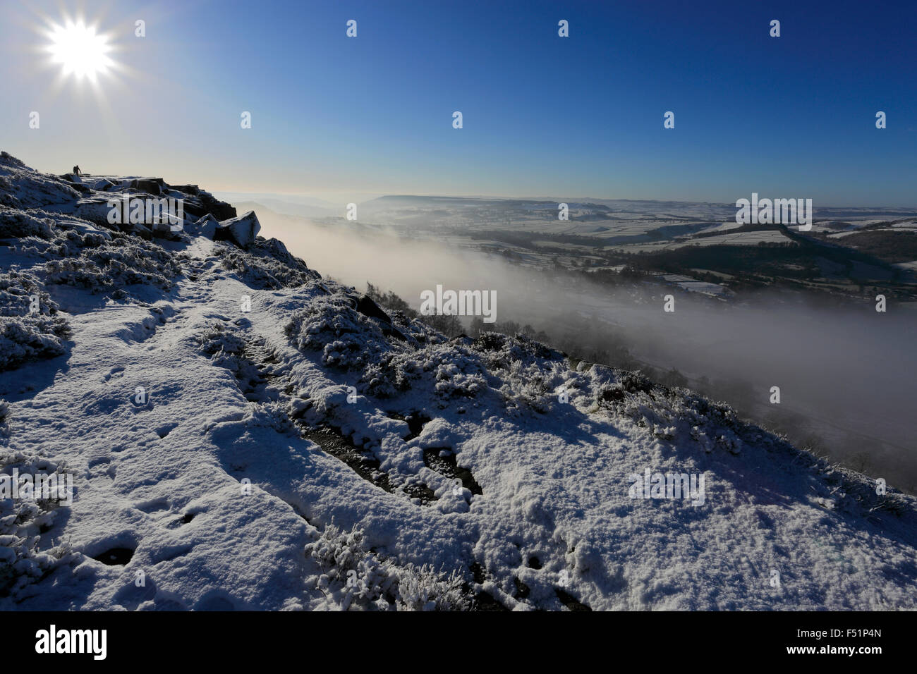 January, winter snow and mist over Curbar valley; Derbyshire County; Peak District National Park; England; UK Stock Photo