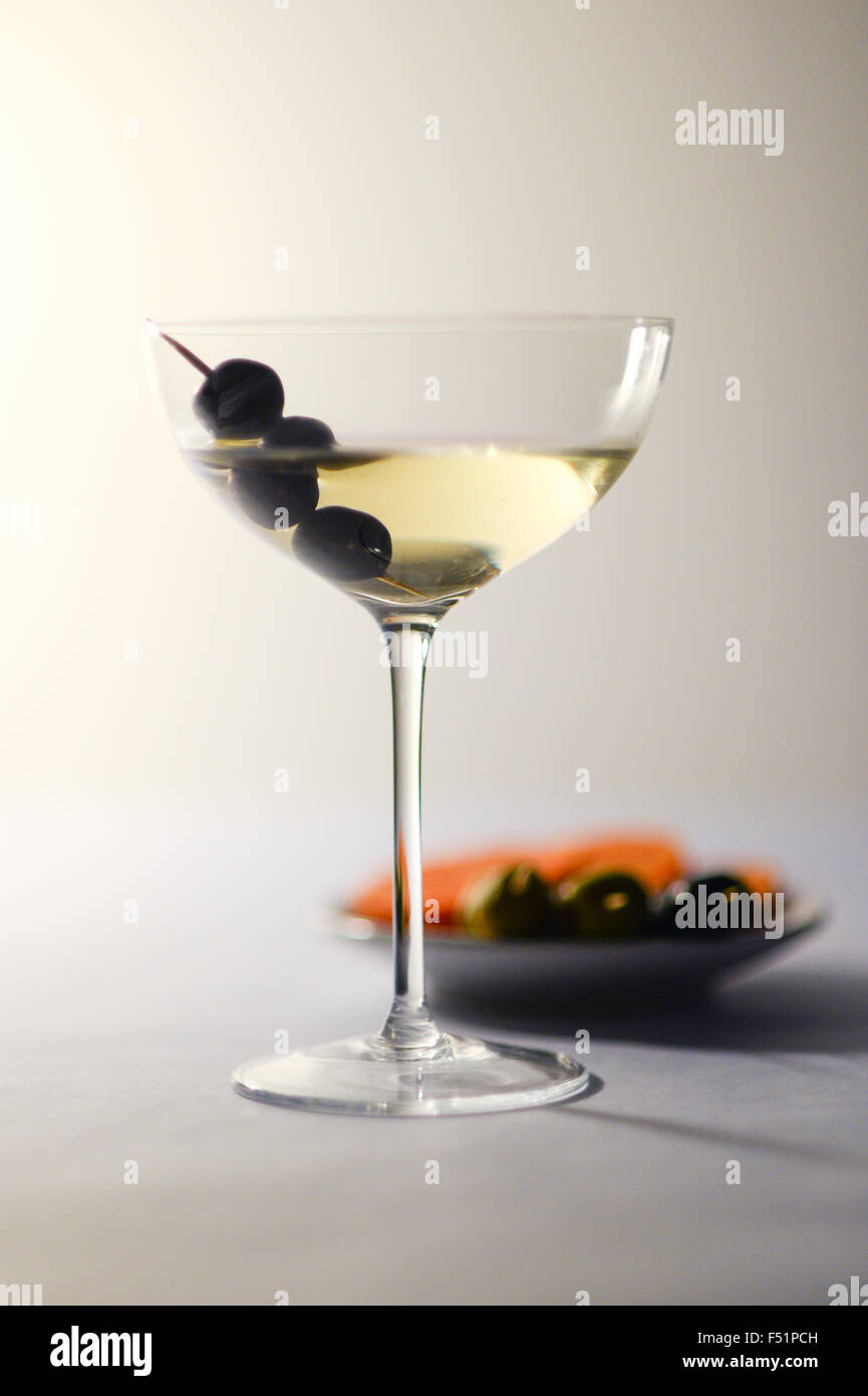 cocktail drink in cocktail glass with olives for party Stock Photo