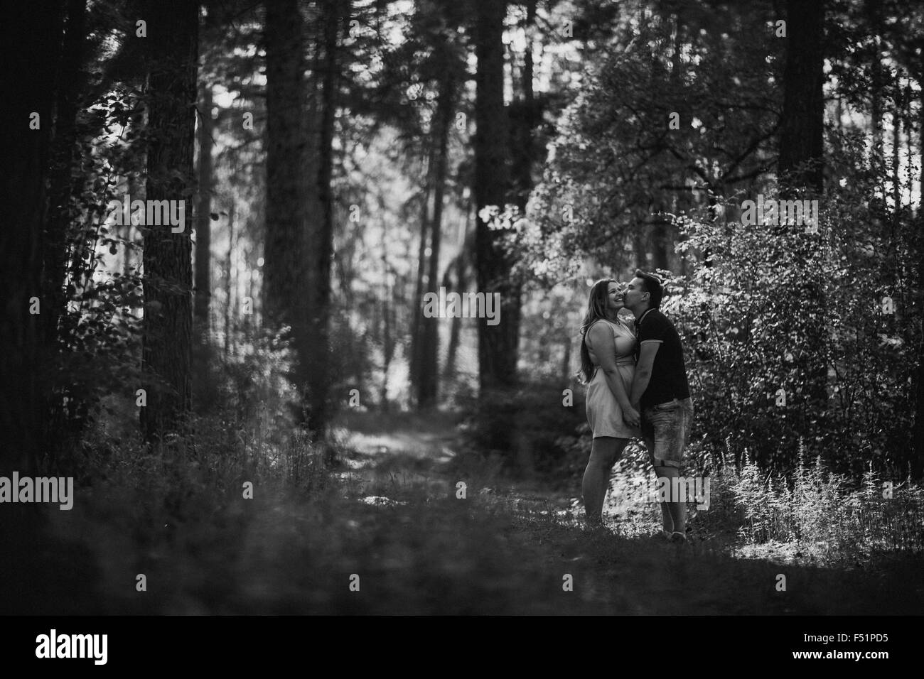 Romantic black and white photo young couple kissing on background ...