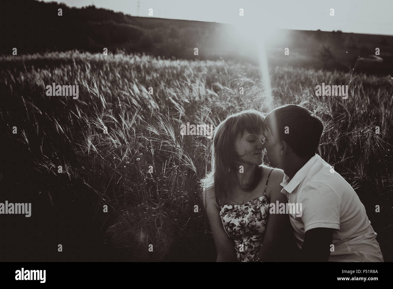 Romantic black white photo couple standing and kissing on background ...