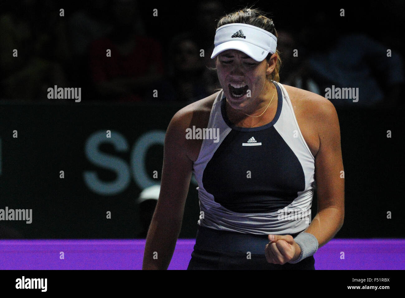 Singapore. 26th Oct, 2015. Garbine Muguruza of Spain reacts during the WTA Finals round robin match against Lucie Safarova of the Czech Republic at Singapore Indoor Stadium in Singapore, Oct. 26, 2015. Garbine Muguruza won 2-0. Credit:  Then Chih Wey/Xinhua/Alamy Live News Stock Photo