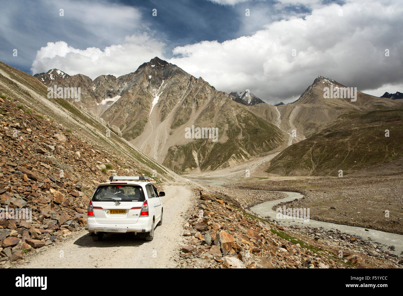 India, Himachal Pradesh, Lahaul Valley, Chhota Dara, Toyota Avensis, car on rocky road through Chandra River valley Stock Photo