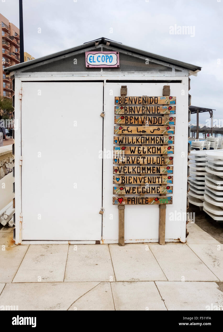 Beach shed with welcome written in eleven languages, Fuengirola, Spain. Stock Photo