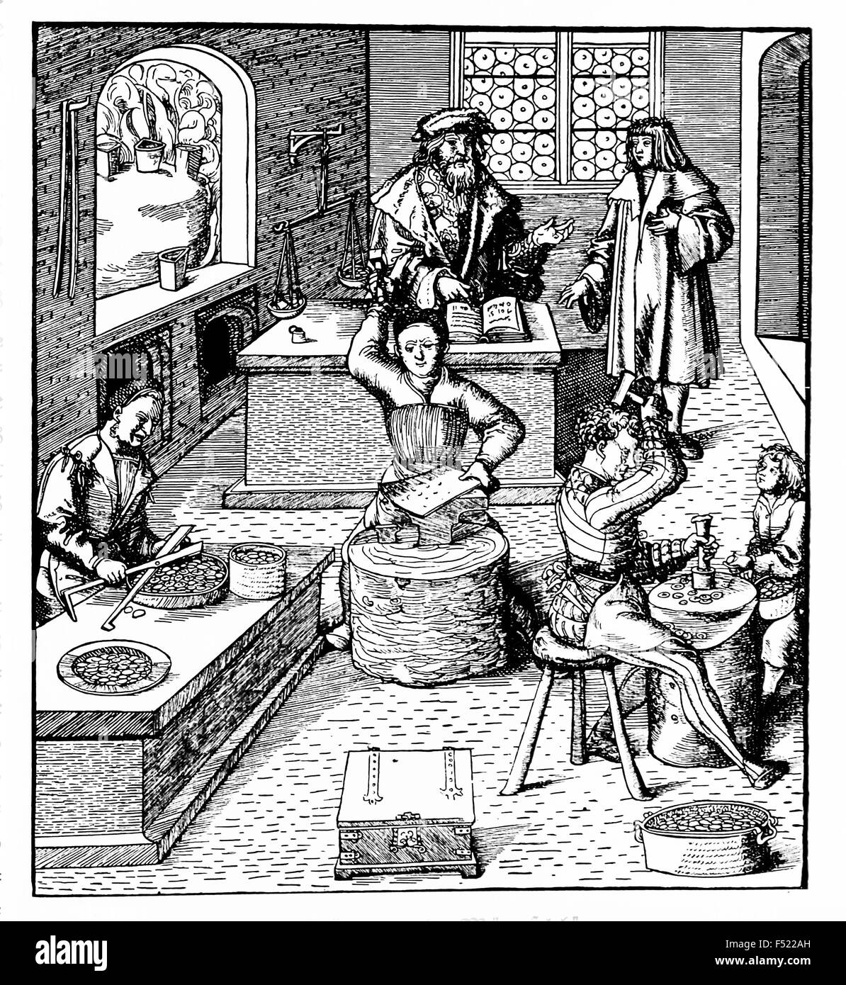 Vintage engraving depicting the work of making coins in a Middle Ages workshop Stock Photo