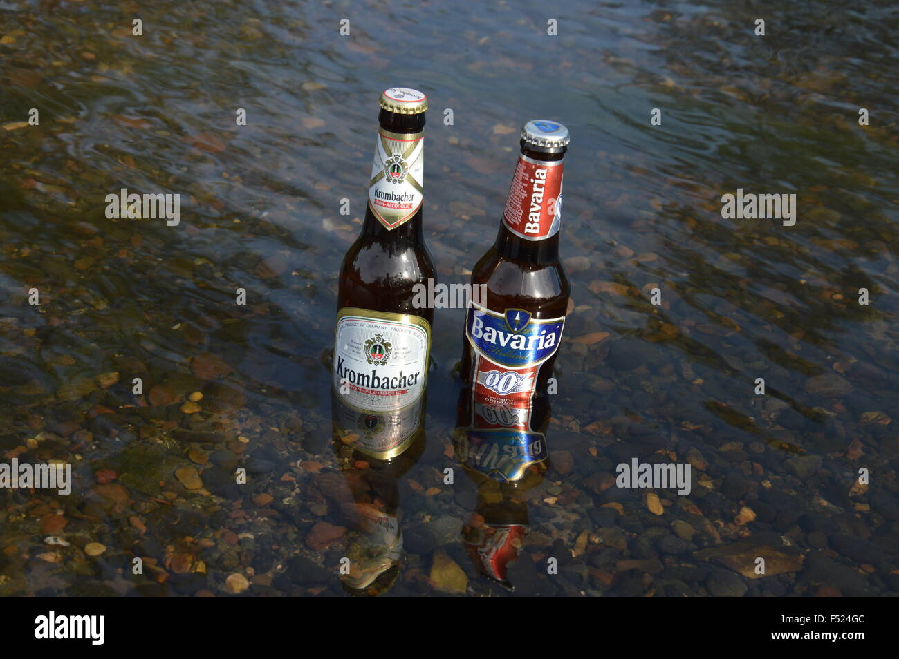 bottle non alcoholic beer Krombacher and Bavaria cooled of in the river Stock Photo Alamy