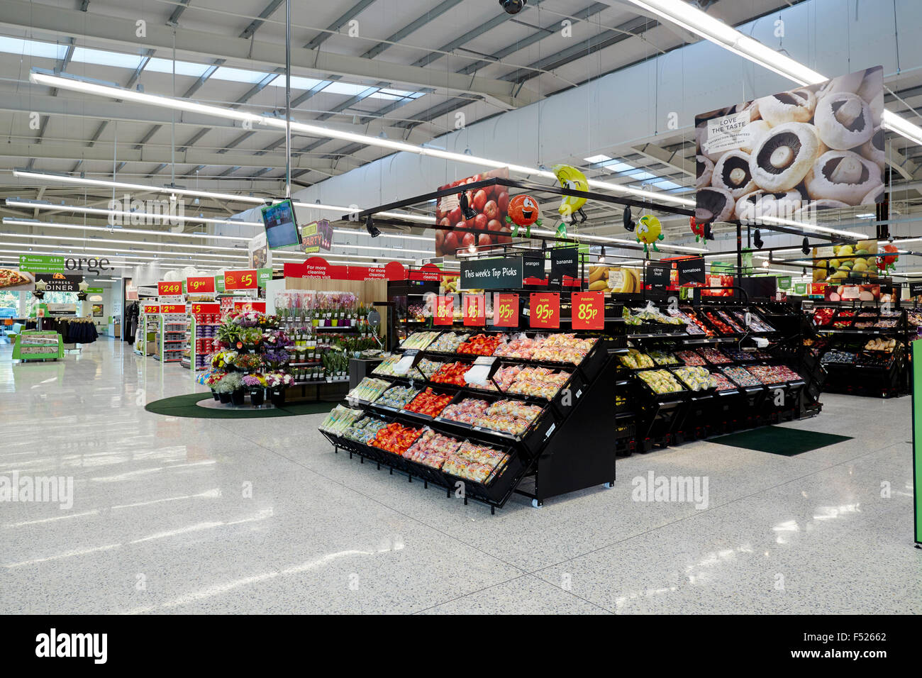 Asda Open their new store in Altrincham, Cheshire, UK on George Richards Way.  Pictured interior of the new store rows fruit veg Stock Photo
