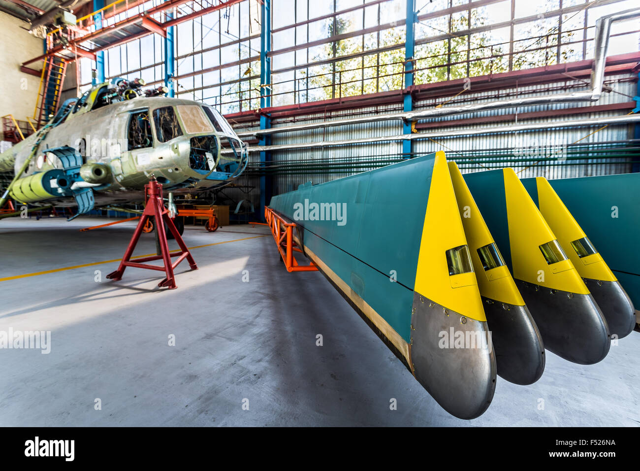 Helicopter rotor blades removed from aircraft Stock Photo