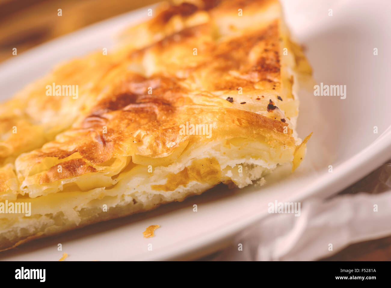 Burek, a traditional Balkan dish in form of cheese pie, selective focus Stock Photo