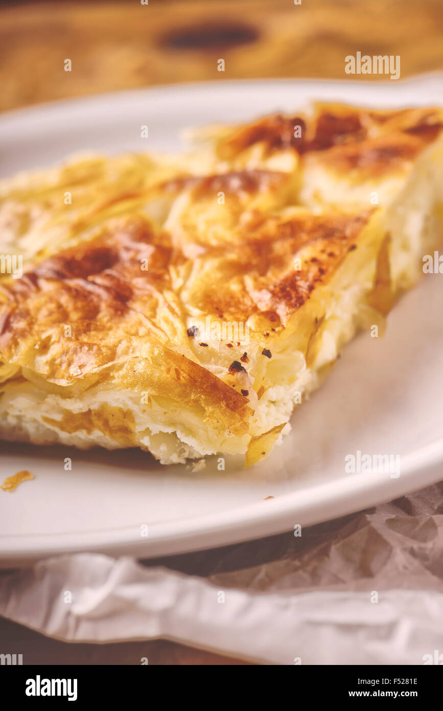 Burek, a traditional Balkan dish in form of cheese pie, selective focus Stock Photo