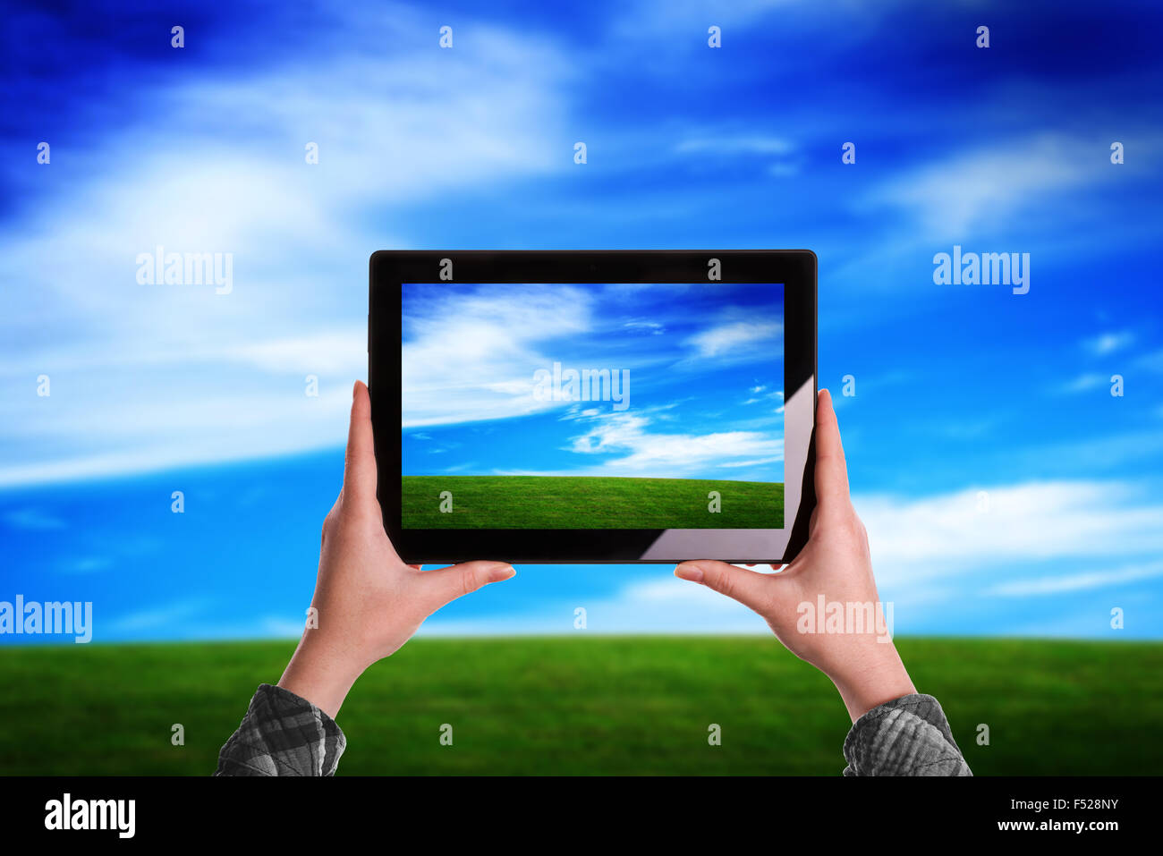 Woman Taking Picture of Beautiful Nature Grassland Landscape with Digital Tablet Computer Stock Photo