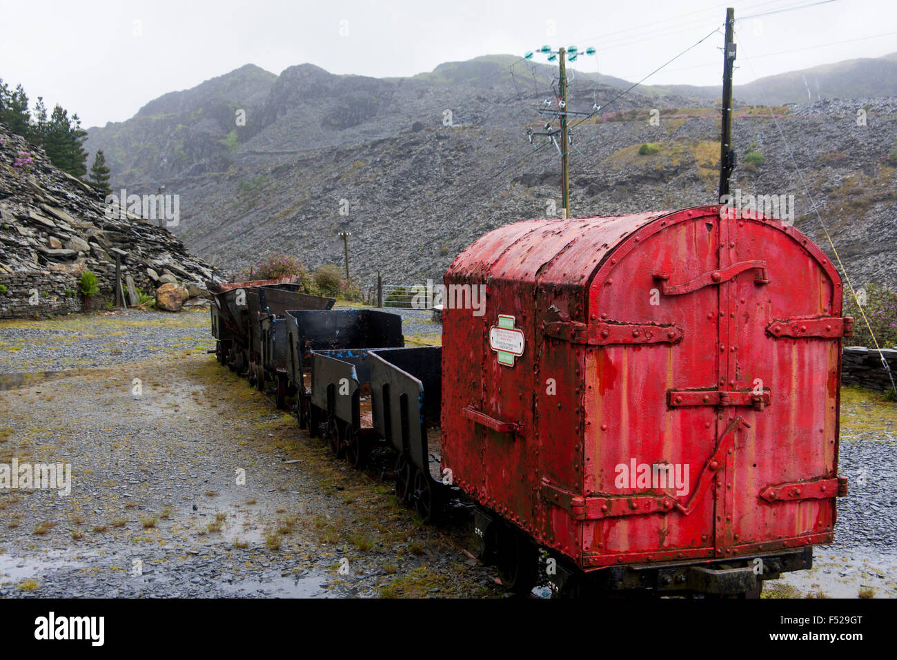 Old red rail wagon part of exhibit at Llechwedd Slate Caverns Blaenau Ffestiniog Gwynedd North Wales UK Stock Photo