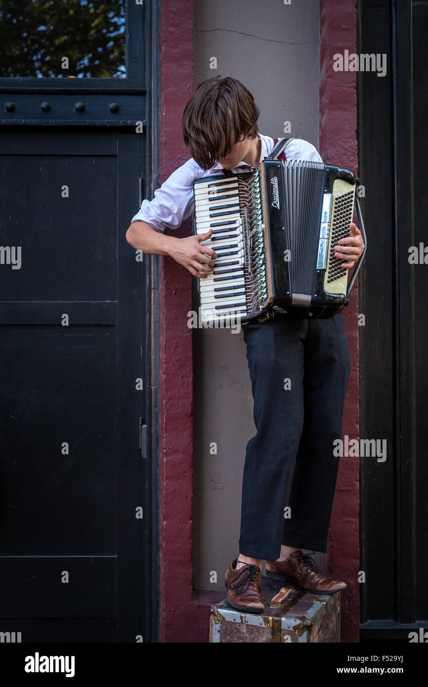A busker plays an accordion, Vancouver, British Columbia, Canada Stock Photo