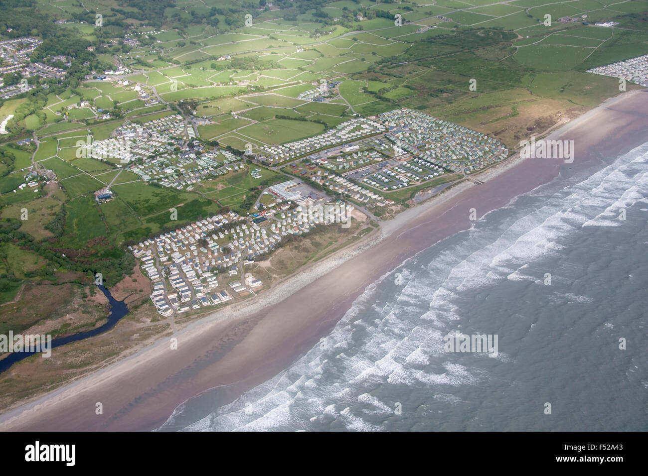 Aerial view of large caravan park holiday park and beach on Cardigan Bay coast north of Barmouth Gwynedd Mid Wales UK Stock Photo