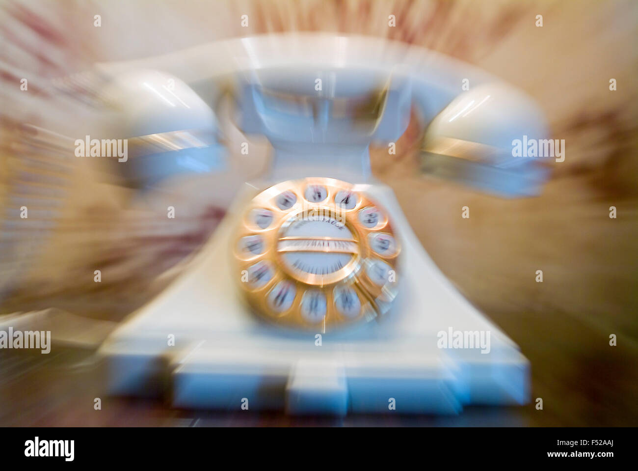 White nostalgic Telephone zoomed blurred Stock Photo