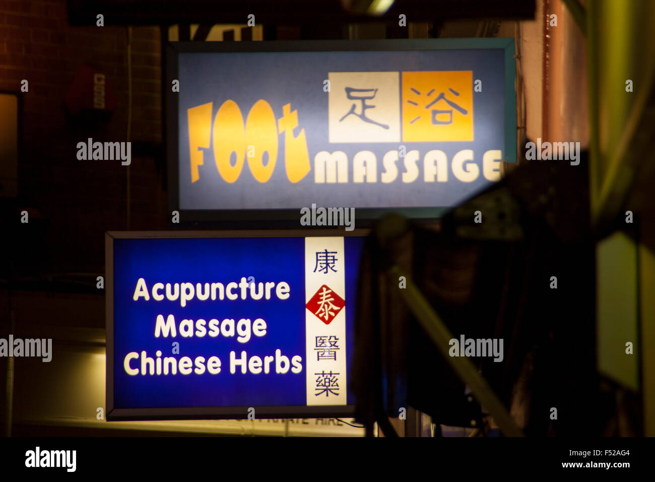 Chinatown London England UK signs for acupuncture herbs and foot