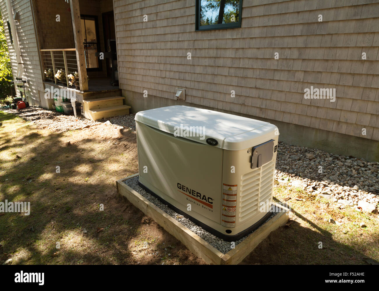 An external backup stand-by Generac generator for a domestic house, USA Stock Photo
