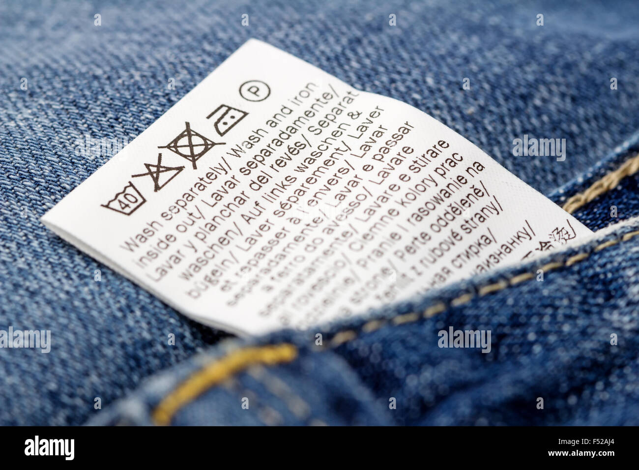 Jeans laundry care label, selective focus Stock Photo - Alamy