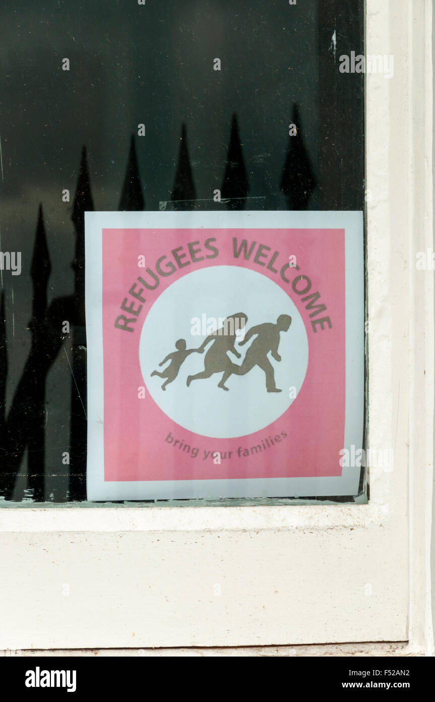 A sign reading Refugees Welcome - Bring your Families on a house window in Ramsgate, Kent. Stock Photo
