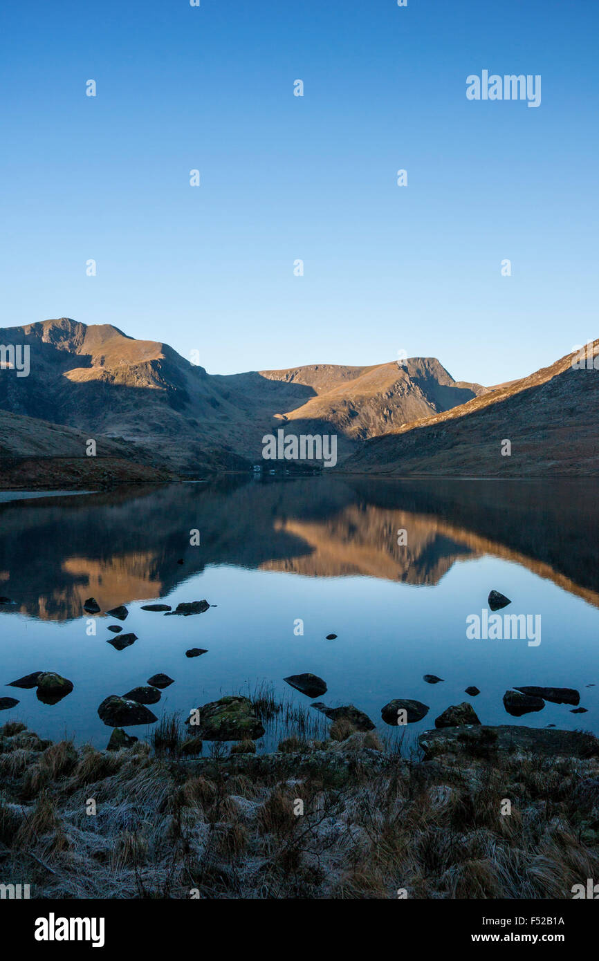 Llyn Ogwen lake with Y Garn and Foel Goch reflected in still water Snowdonia North Wales UK Stock Photo