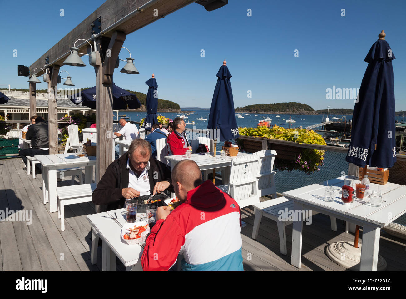 Customers eating at Stewmans Downtown Lobster Pound seafood restaurant, Bar Harbor, Maine USA Stock Photo