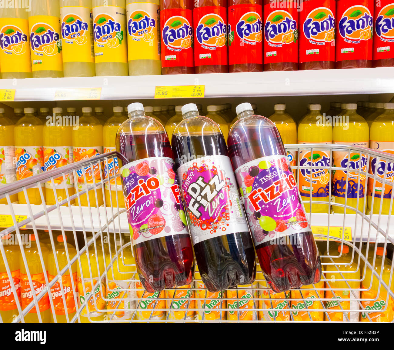 Fizzio and Dr, Fizz fizzy carbonated juice drinks in shopping trolley in Tesco supermarket. UK Stock Photo