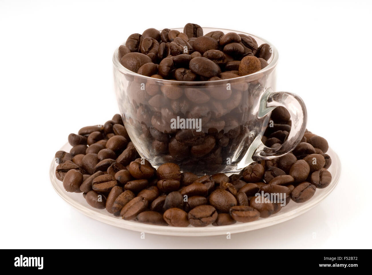 Espresso cup filled with coffee beans Stock Photo
