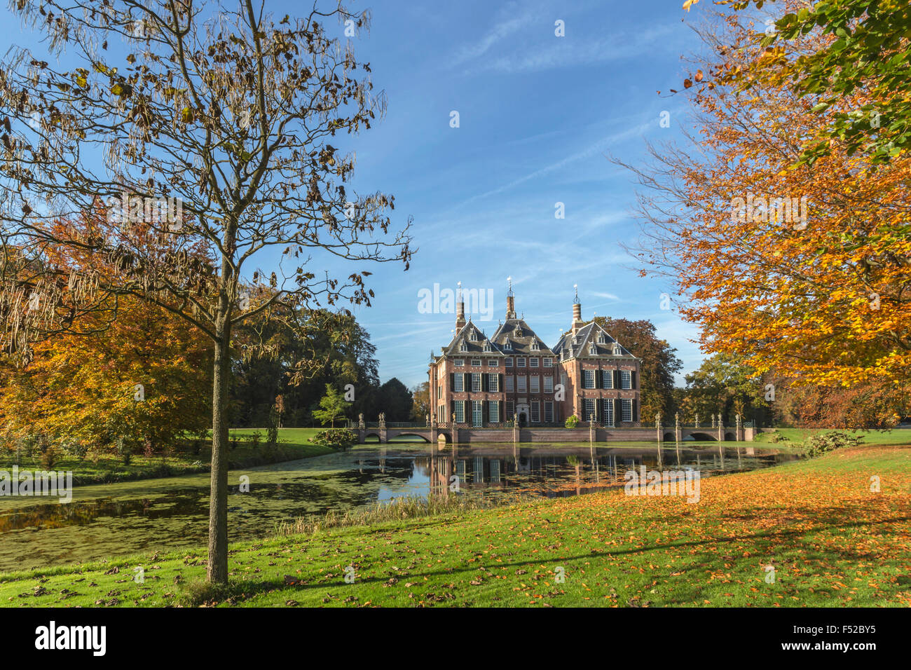Fall colors at Duivenvoorde Castle, Voorschoten, South Holland, The Netherlands. Build in 1631 and with English landscape park. Stock Photo
