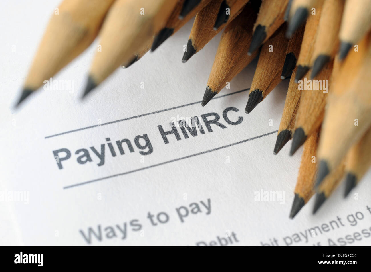 HMRC LETTER WITH PENCILS RE TAX TAXATION SELF ASSESSMENT PAYMENT PAYING FINES OFFICE  INLAND REVENUE CUSTOMS LATE FORM FORMS UK Stock Photo