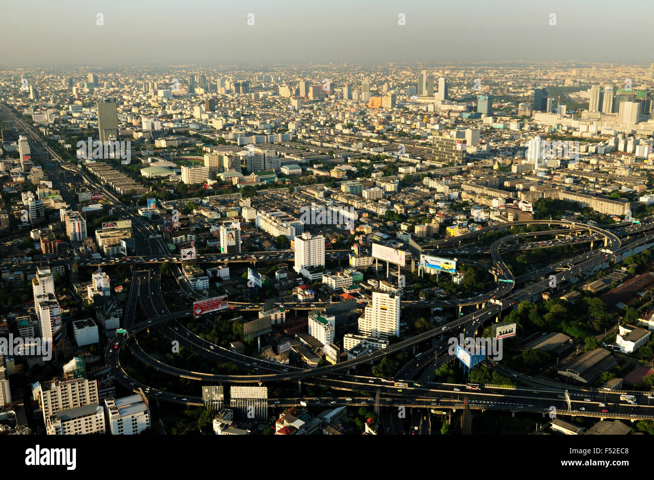 Highways and buildings of Bangkok from Baiyoke Tower II (the tallest building in the city) at sunset, Thailand Stock Photo