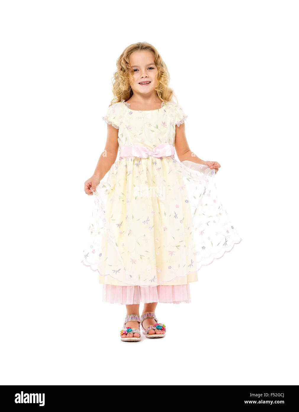 Little Girl in a Light Dress Posing, on white background Stock Photo ...