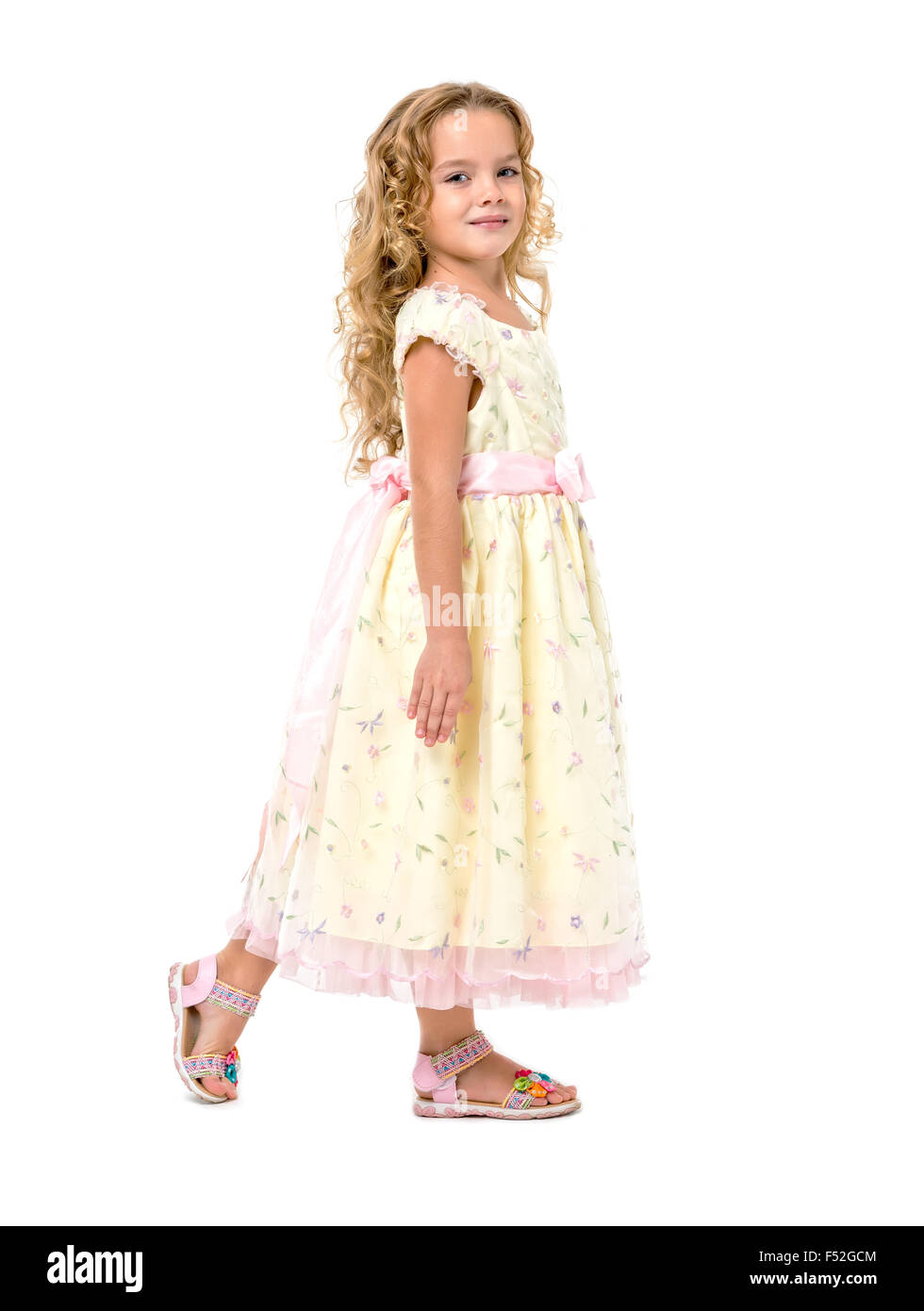 Little Girl in a Light Dress Posing, on white background Stock Photo ...