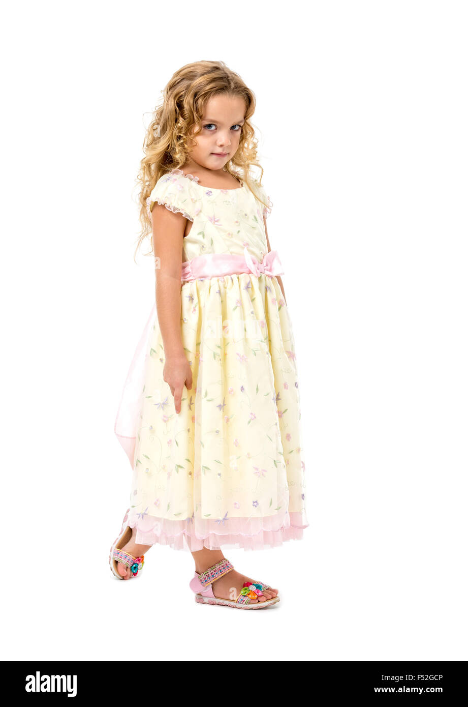 Little Girl in a Light Dress Posing, on white background Stock Photo ...