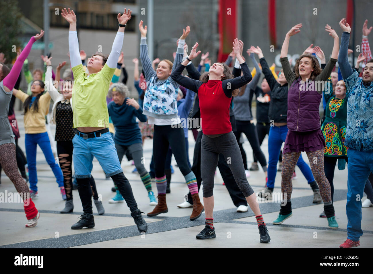 Many people dance in the  Queen Elizabeth Theatre square in downtown of Vancouver BC Stock Photo