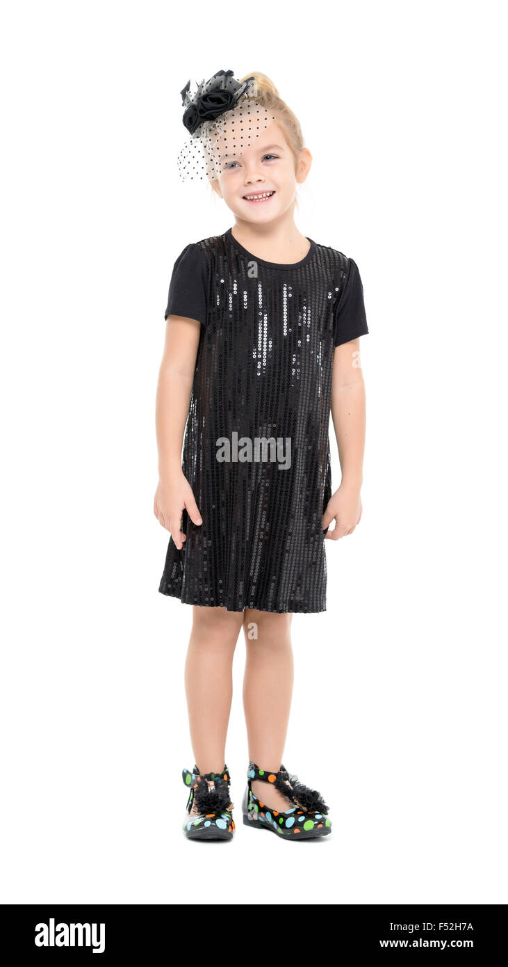 Little Girl in a Black Dress Posing, on white background Stock Photo