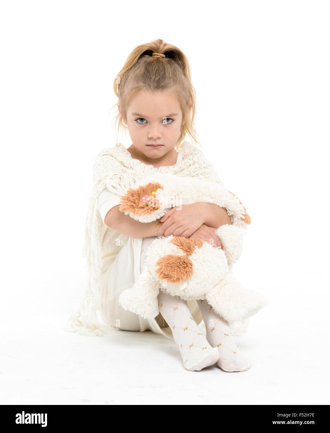 Little Girl in a White Dress Posing, on white background Stock Photo ...