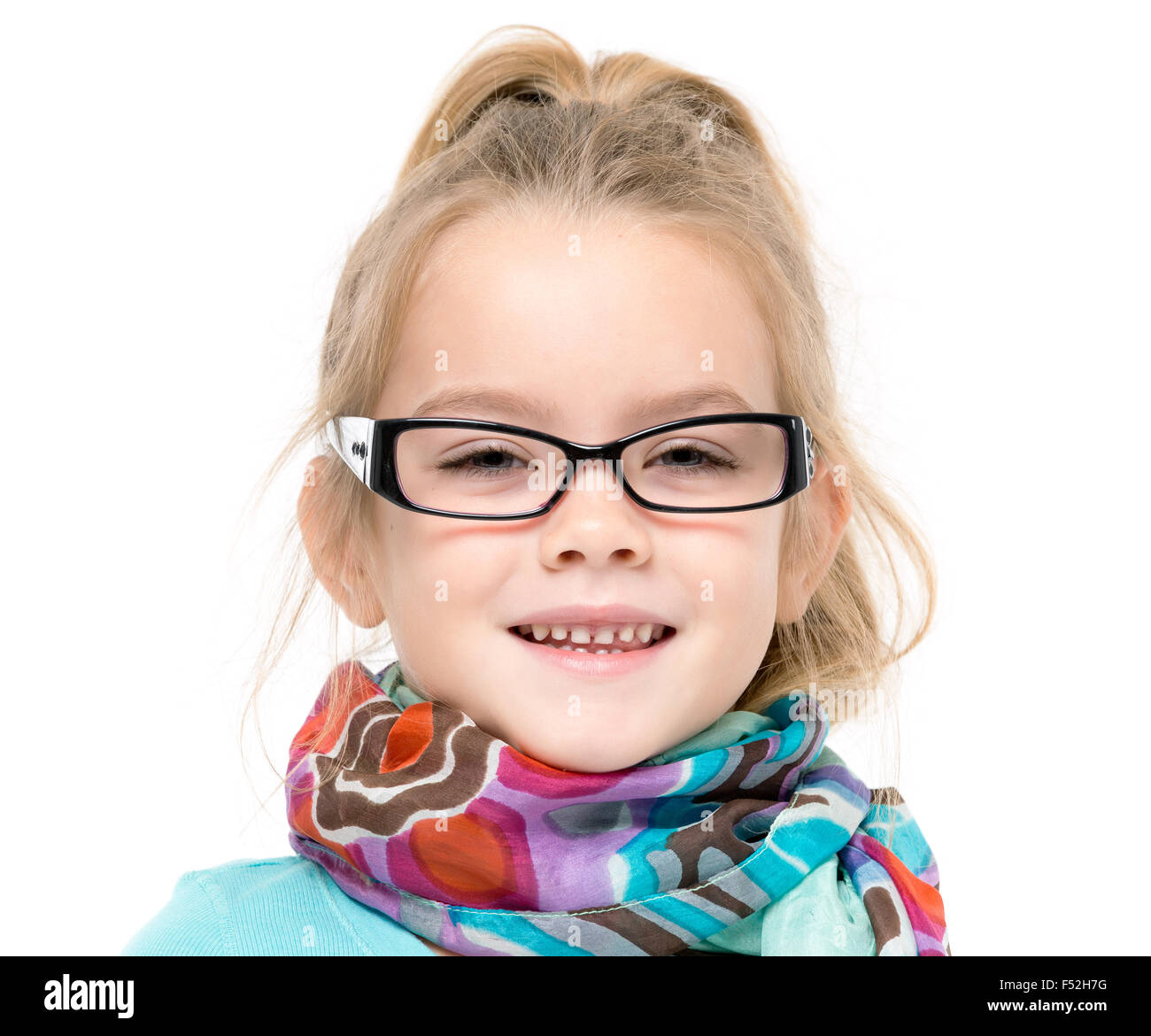 Little Girl in Eyeglasses Posing, on white background Stock Photo