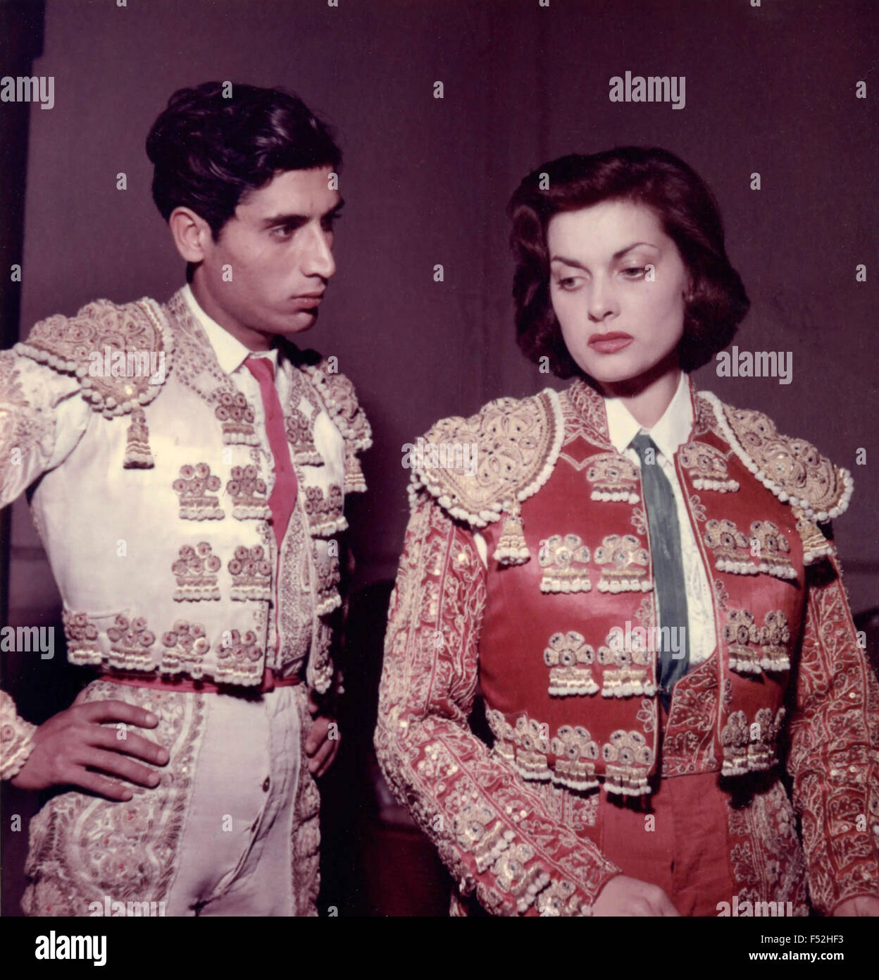 The Italian actress Lucia Banti while dressing bullfighter for filming of ' Fiesta Brava ' Stock Photo