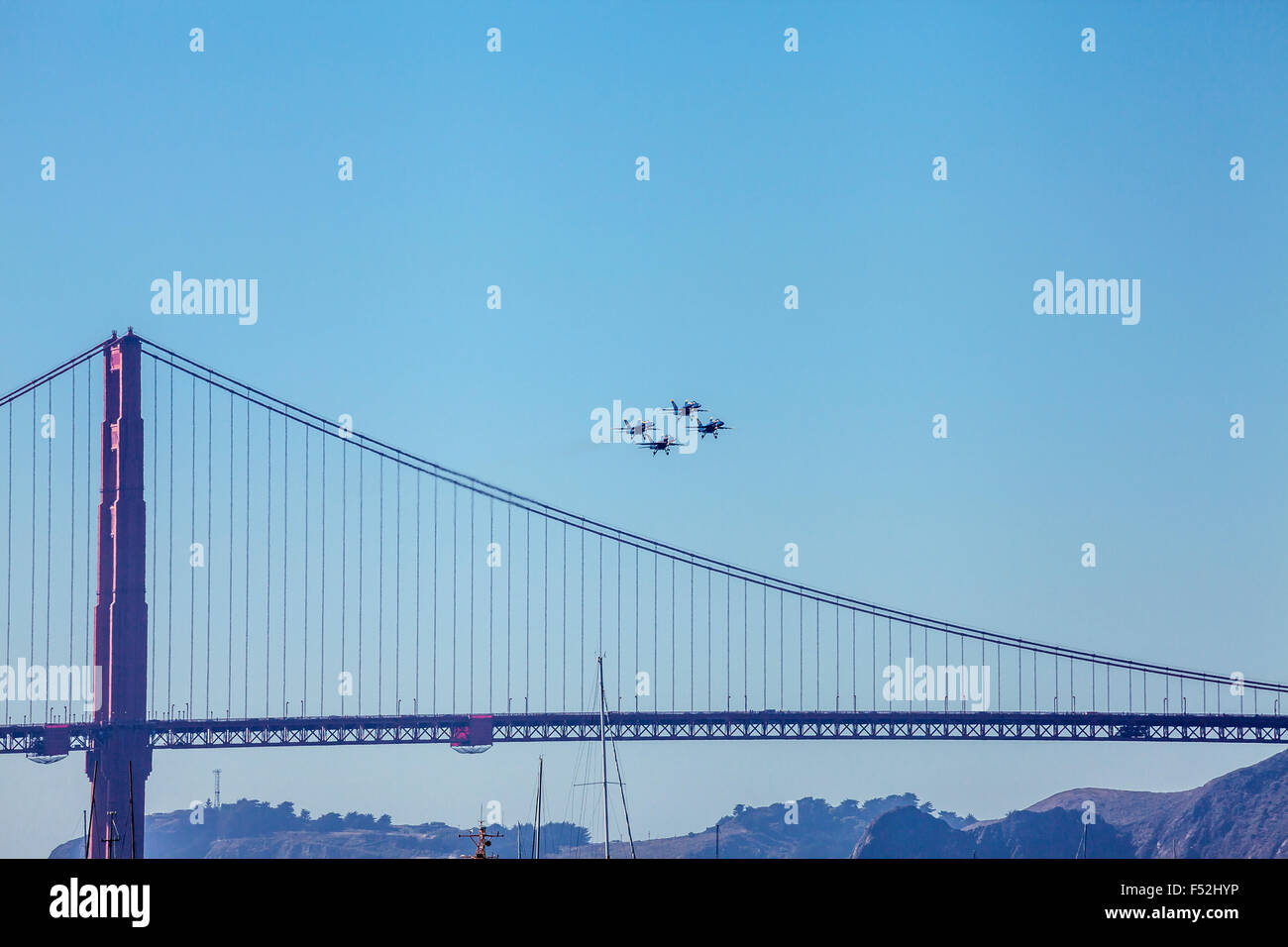 Blue Angels F/A-18 Hornet aircrafts performing flight formation over the Golden Gate Bridge, San Francisco, California, USA Stock Photo