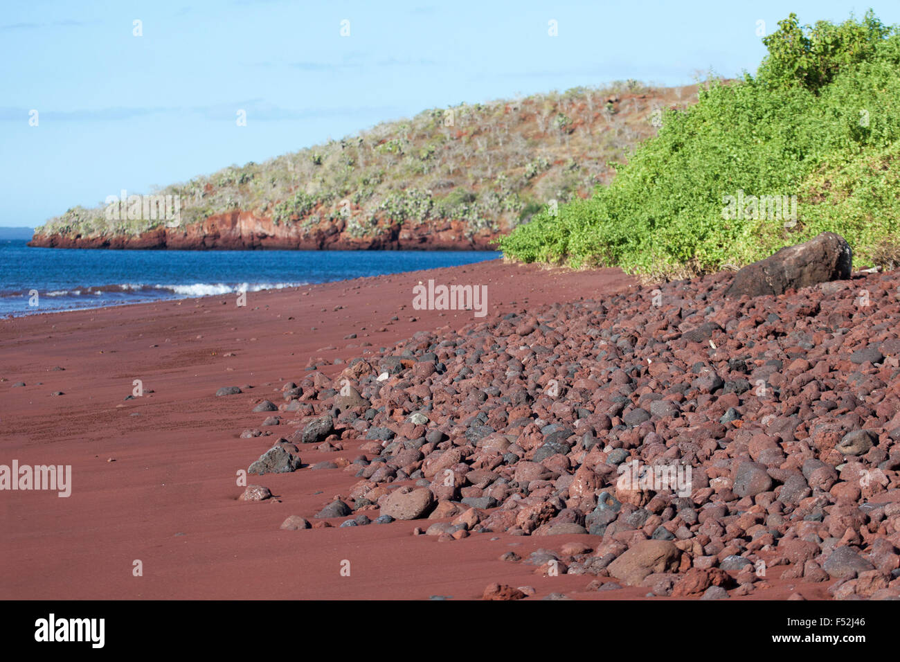 Galapagos red sand beach on Rabida Island. The red color is from oxidation of iron-rich volcanic lava Stock Photo